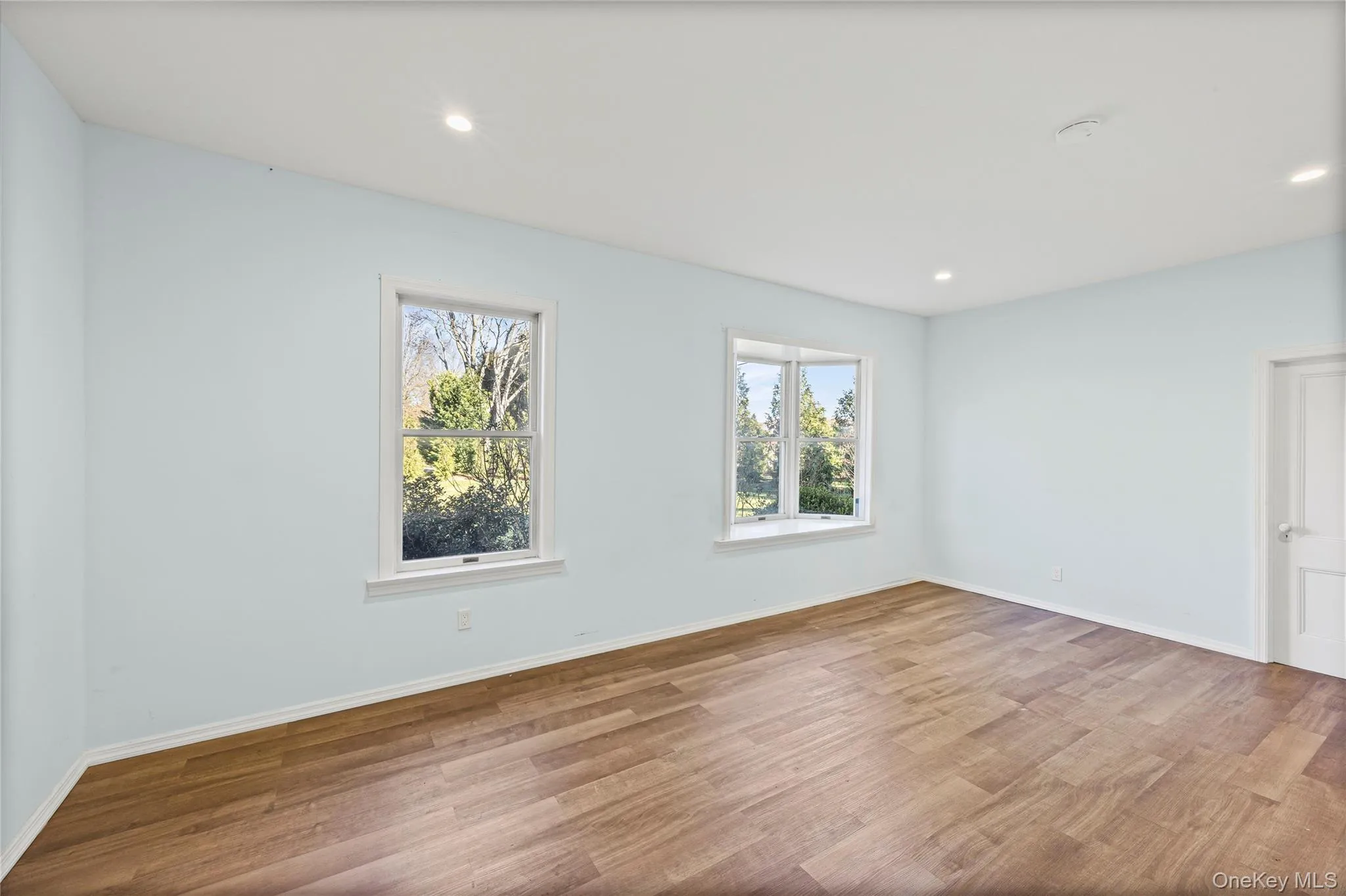 Craft room featuring wood finished floors and recessed lighting Craft room featuring wood finished floors and recessed lighting