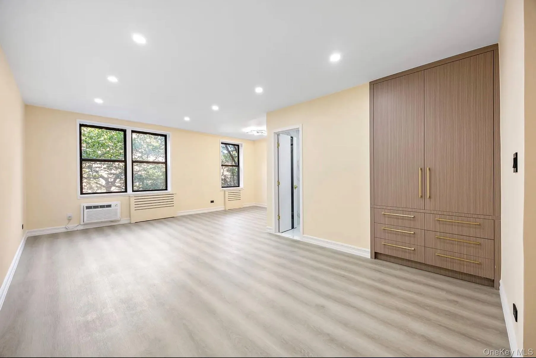 Unfurnished bedroom with recessed lighting and light wood finished floors Unfurnished bedroom with recessed lighting and light wood finished floors