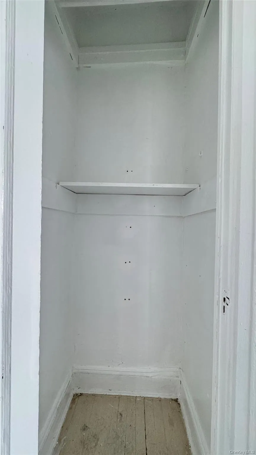 Laundry room with hardwood / wood-style floors Laundry room with hardwood / wood-style floors