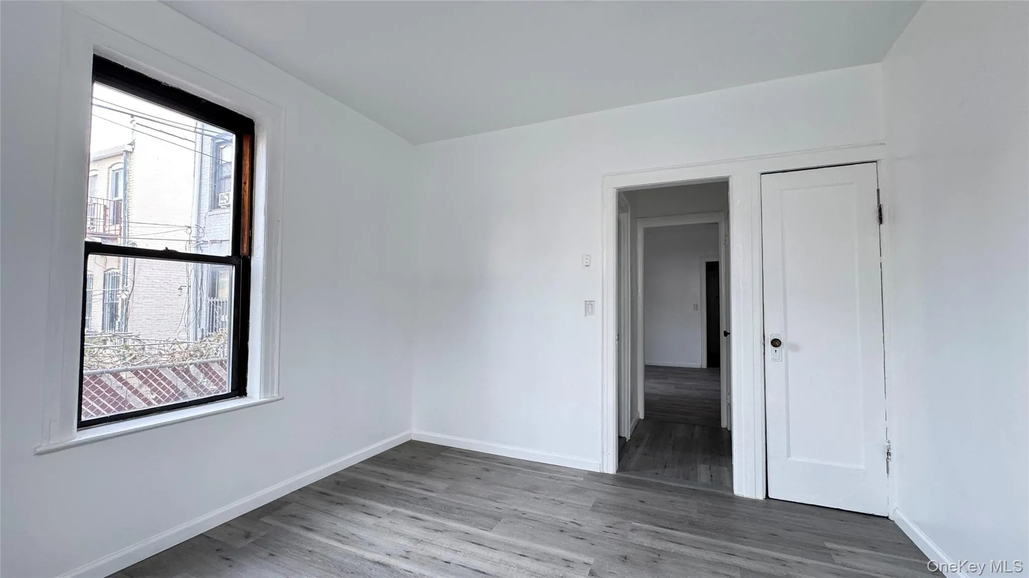 Spare room featuring wood finished floors Spare room featuring wood finished floors