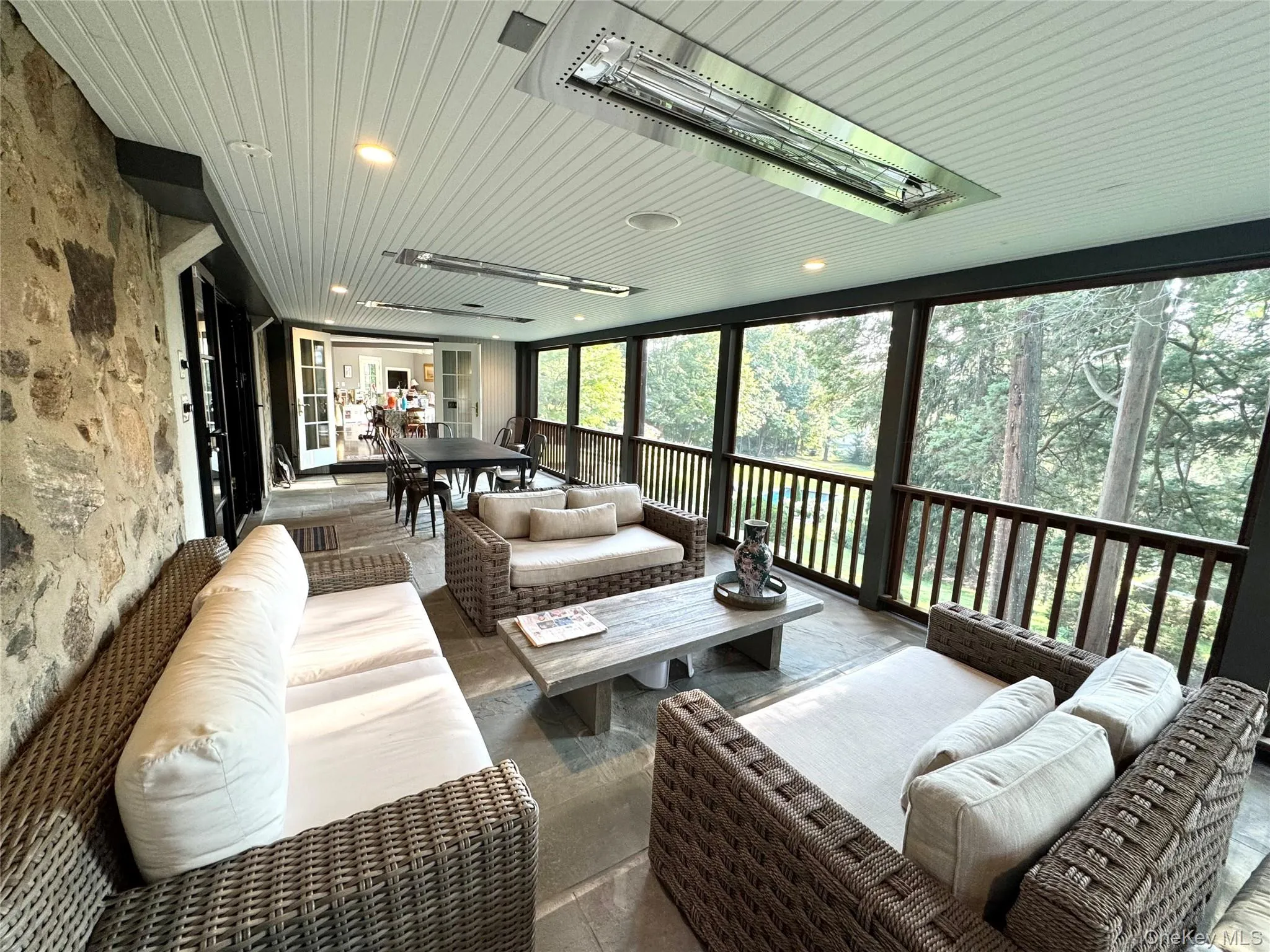 Heated screen porch with outdoor living room Heated screen porch with outdoor living room