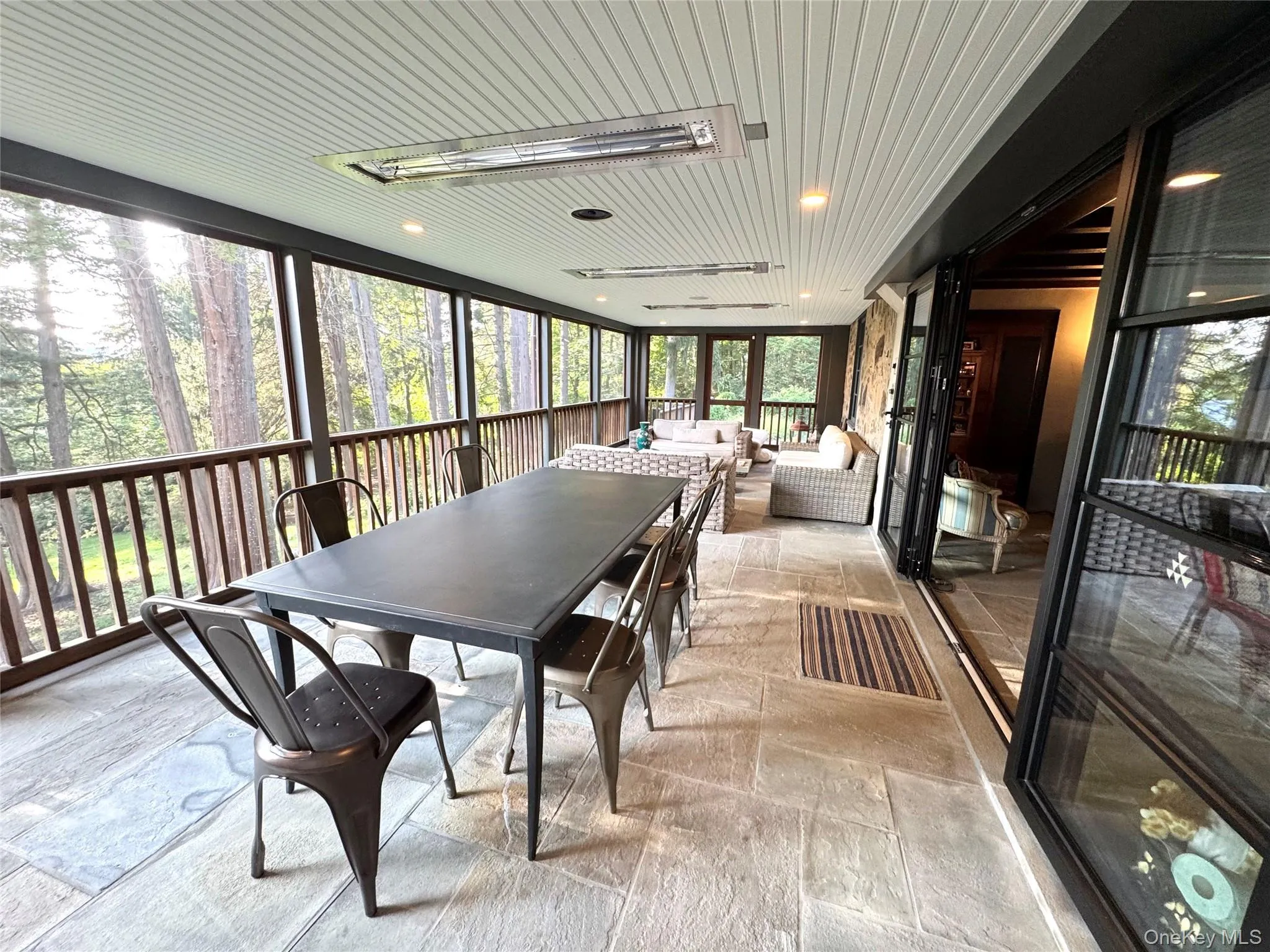 Heated screen porch with outdoor dining Heated screen porch with outdoor dining
