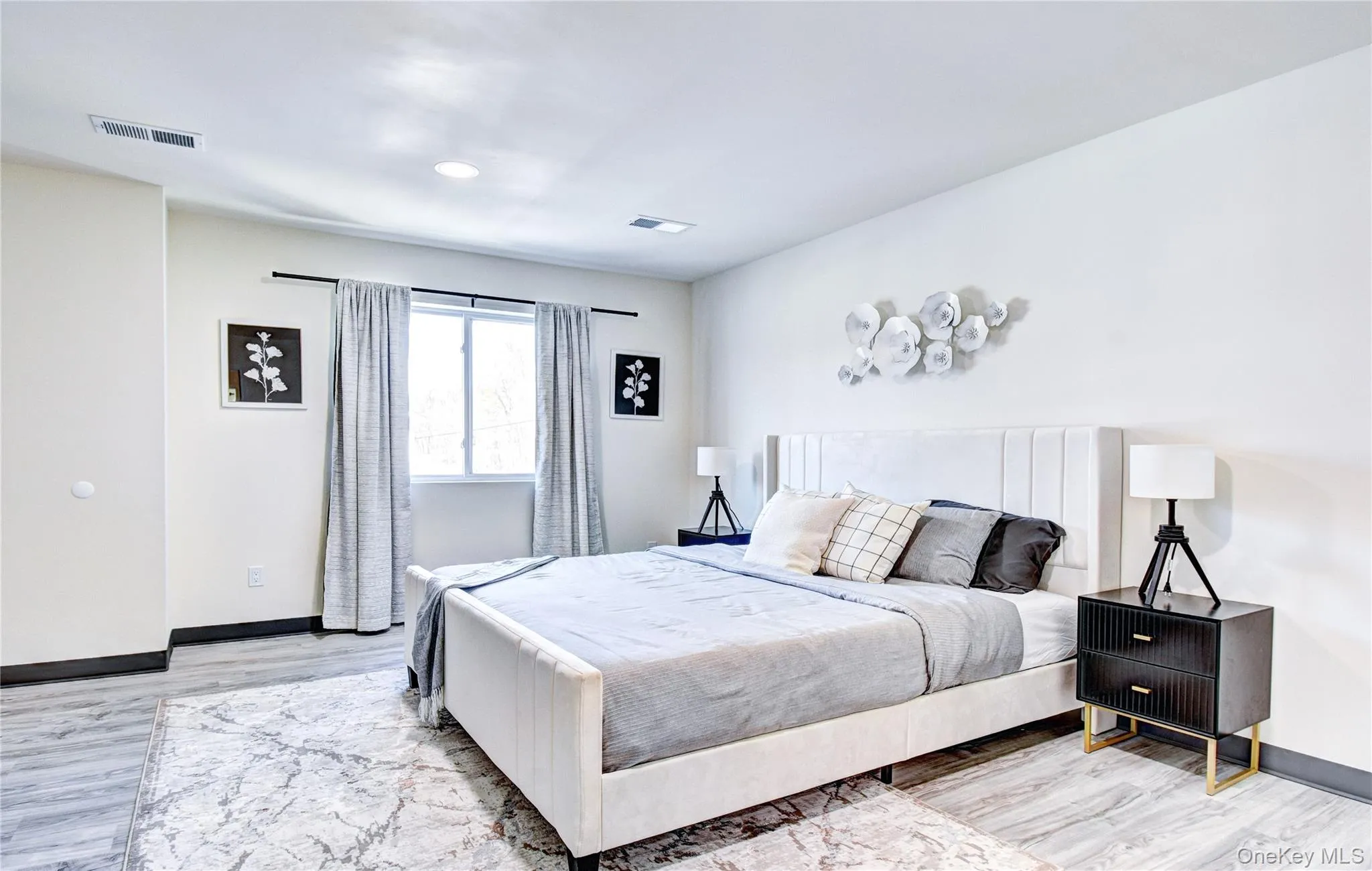 Bedroom with light wood-type flooring Bedroom with light wood-type flooring
