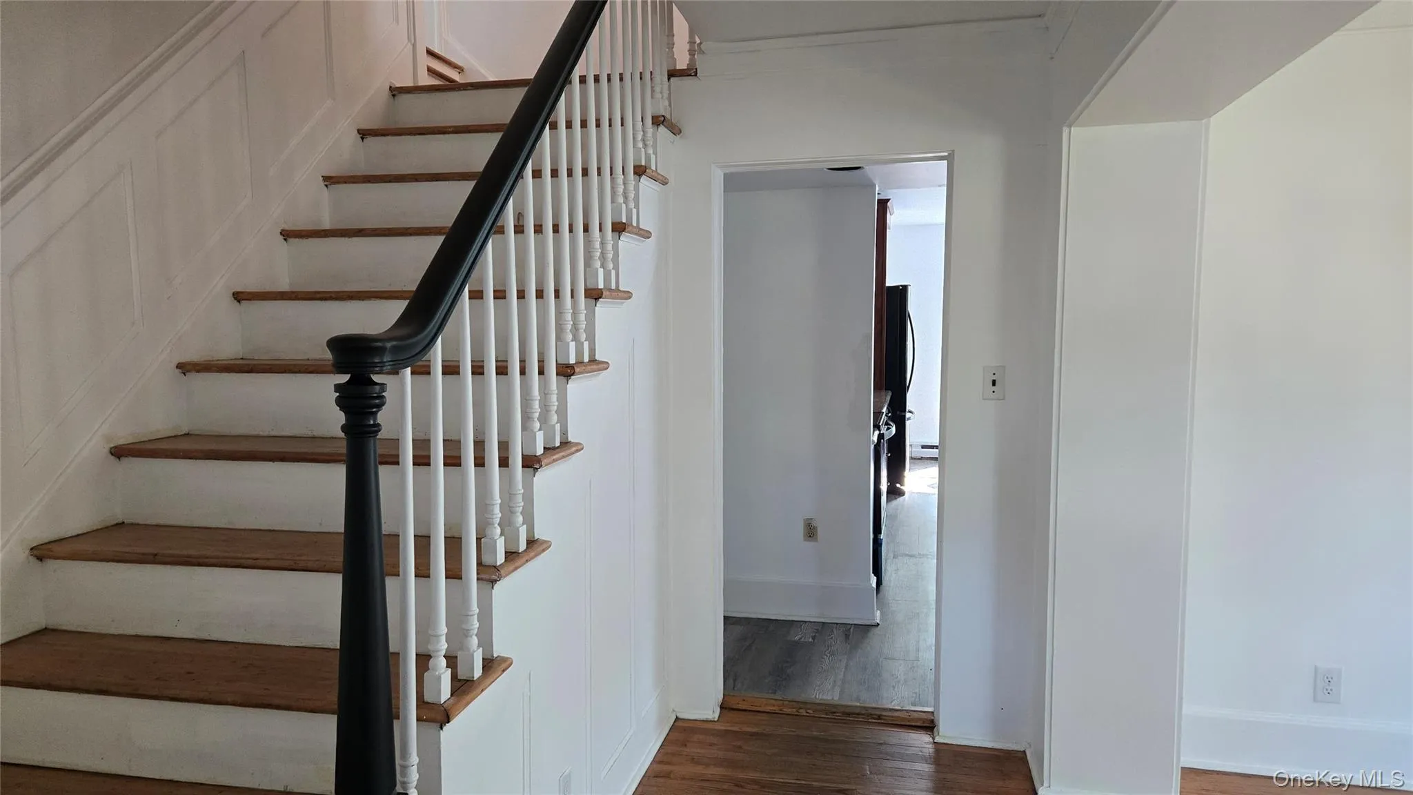 Stairs with wood finished floors and baseboards Stairs with wood finished floors and baseboards