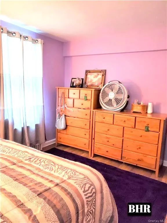 Bedroom with wood finished floors Bedroom with wood finished floors