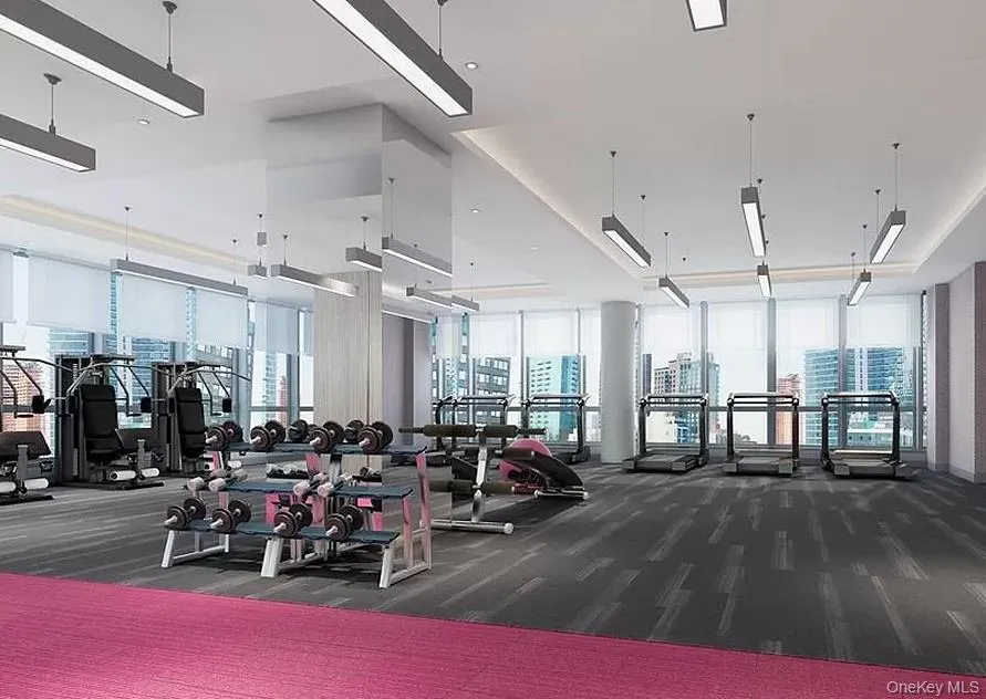 Workout area featuring a wall of windows Workout area featuring a wall of windows