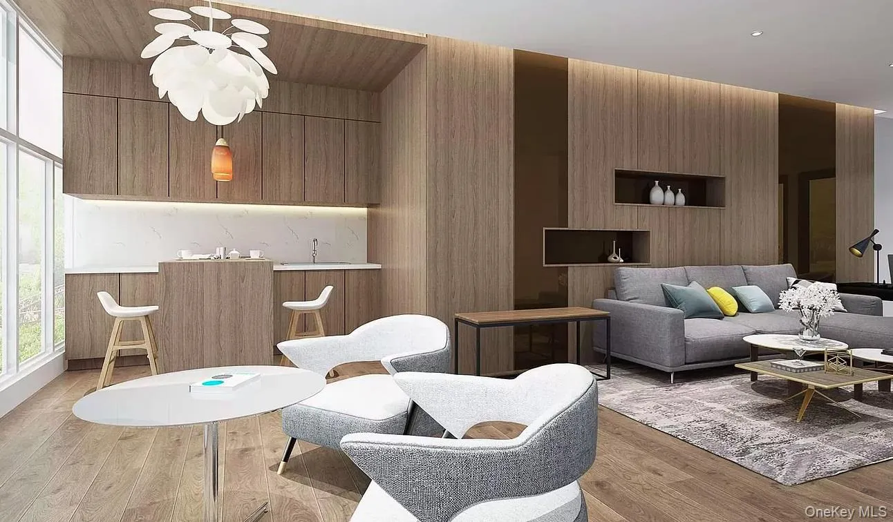 Living area featuring light wood-type flooring and wooden walls Living area featuring light wood-type flooring and wooden walls