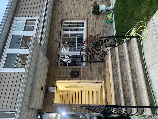 Property entrance featuring brick siding Property entrance featuring brick siding
