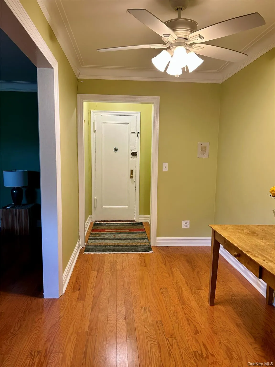 Entrance foyer looking back at apartment entrance Entrance foyer looking back at apartment entrance