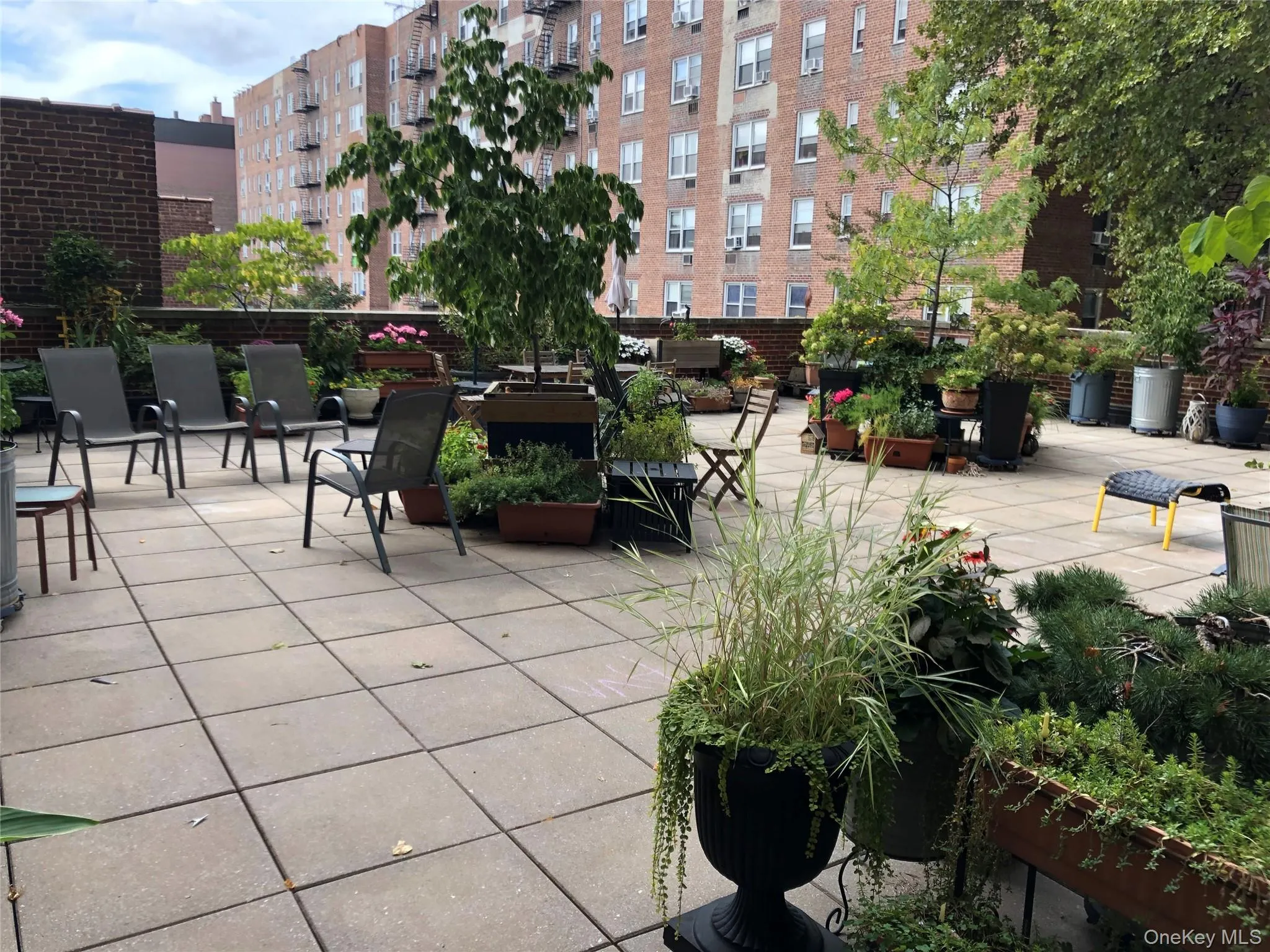 Patio space to relax, read a book. Have a cup of coffee or glass of wine among the greenery without leaving your building! Patio space to relax, read a book. Have a cup of coffee or glass of wine among the greenery without leaving your building!