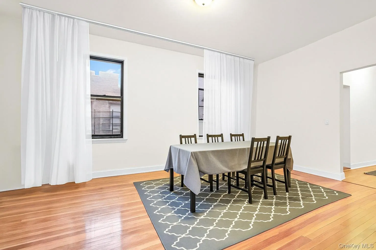 Dining room featuring light wood-style flooring and baseboards Dining room featuring light wood-style flooring and baseboards