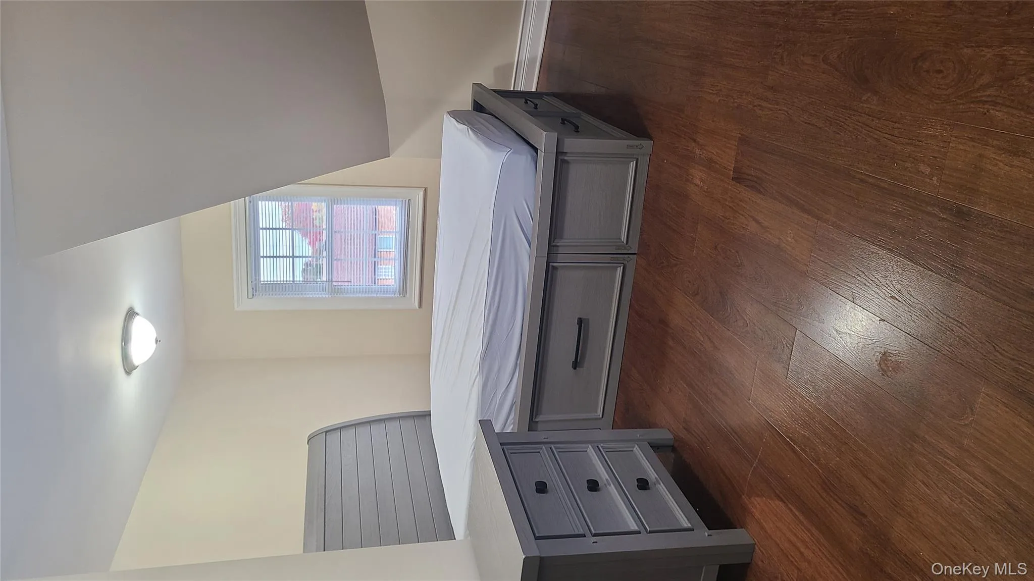 Bedroom with dark wood-style floors Bedroom with dark wood-style floors