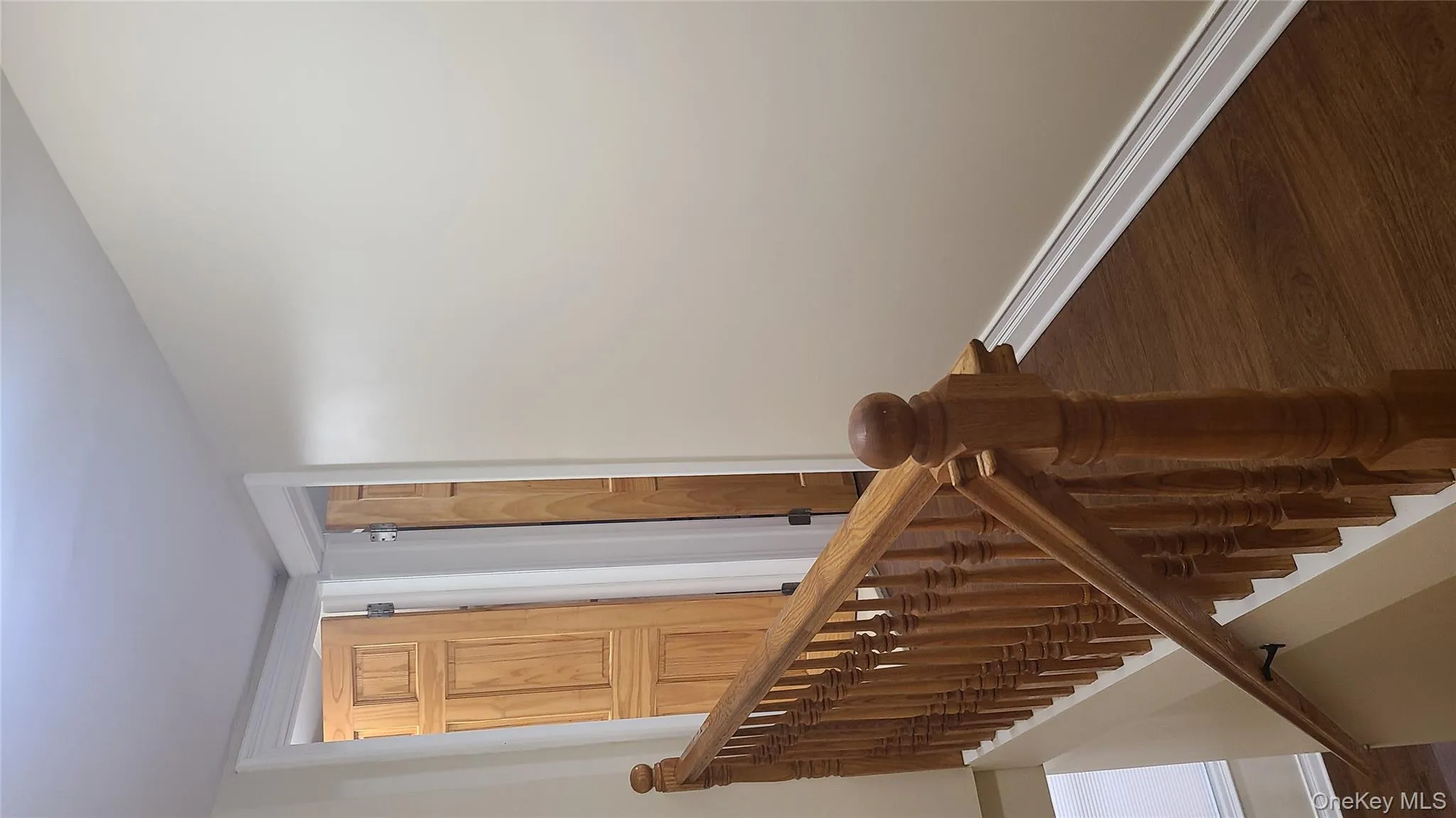 Stairway with wood finished floors and baseboards Stairway with wood finished floors and baseboards