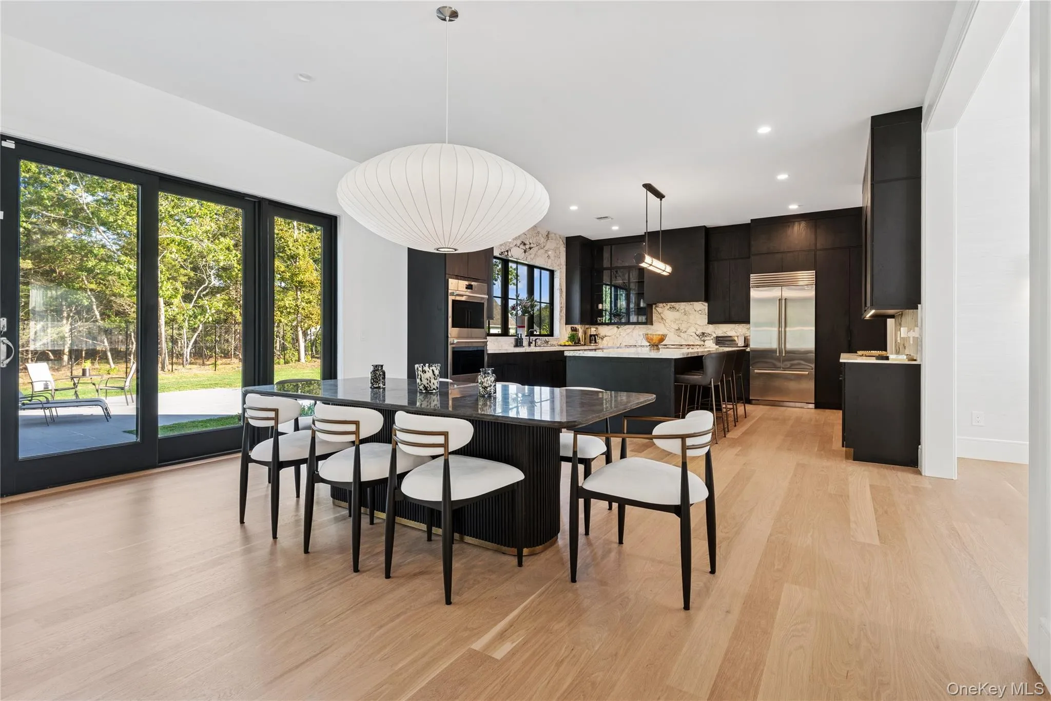 Dining space featuring light wood-type flooring and recessed lighting Dining space featuring light wood-type flooring and recessed lighting
