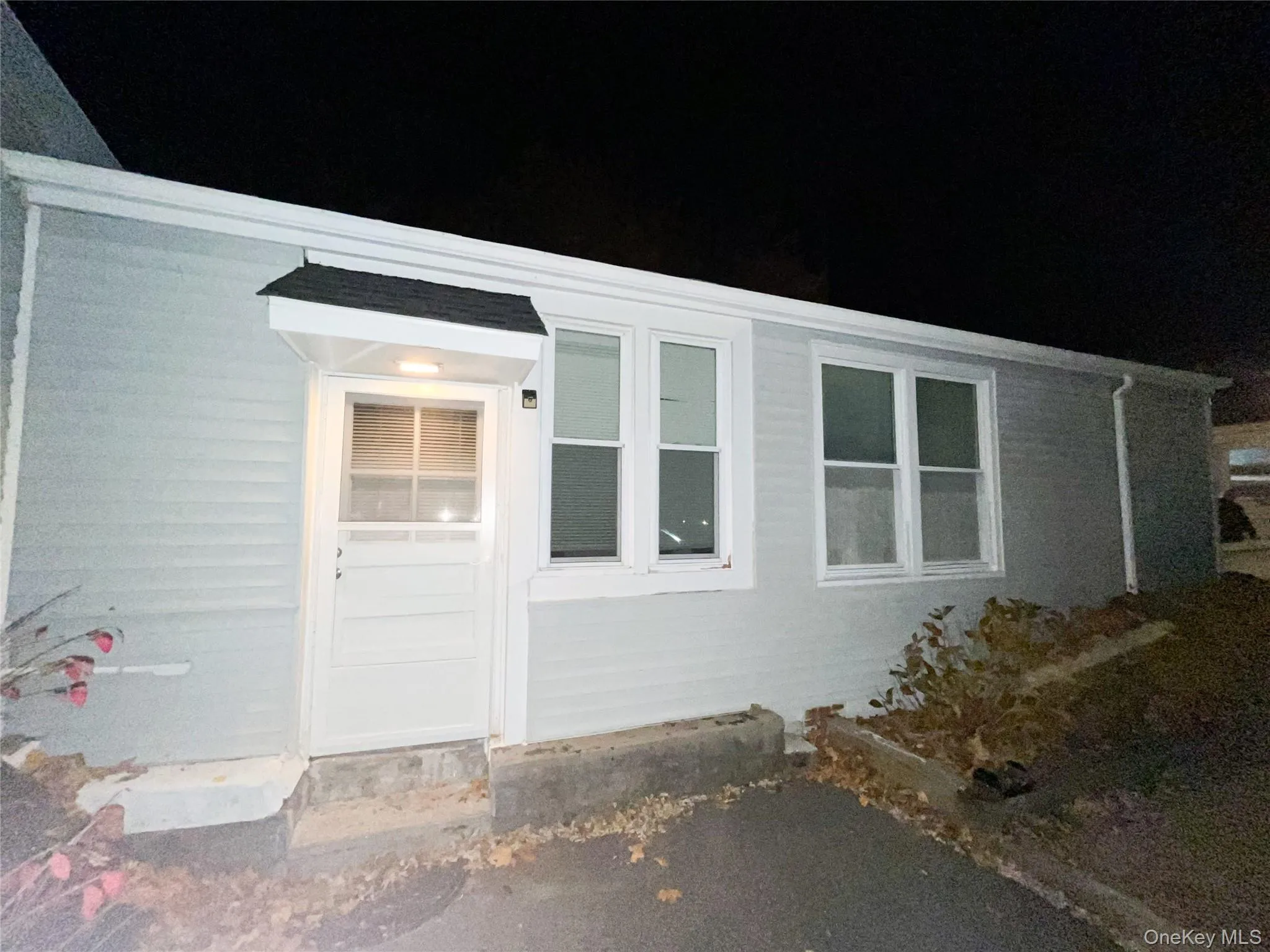 View of exterior entry at twilight View of exterior entry at twilight