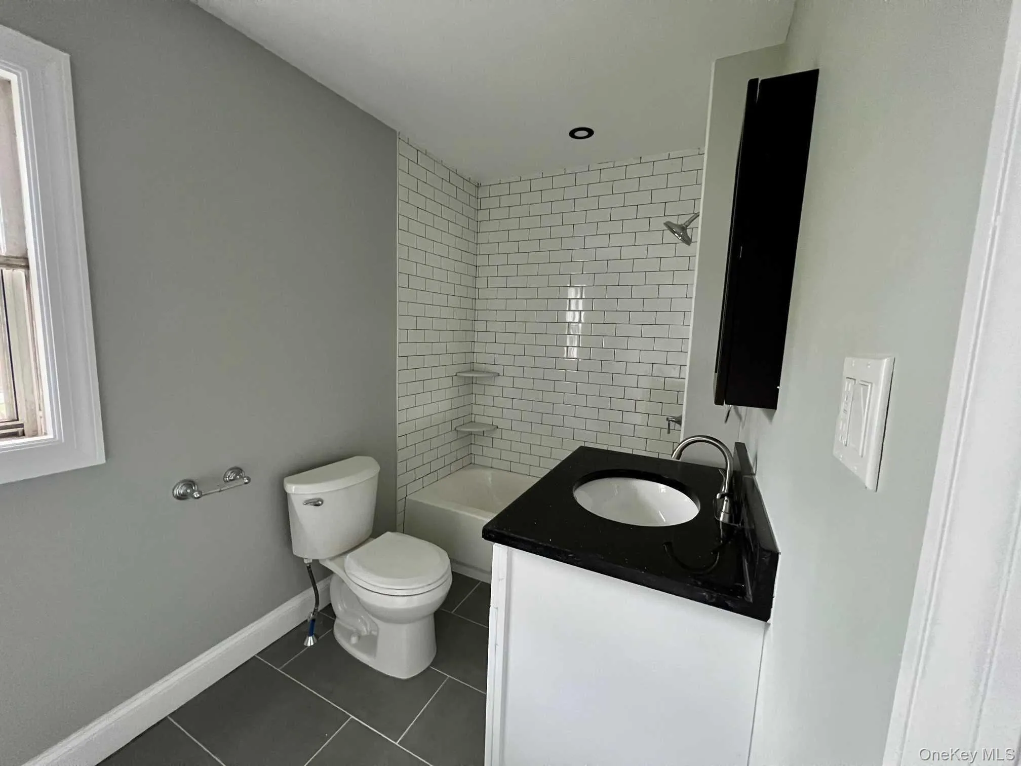 Bathroom with tile floor Bathroom with tile floor