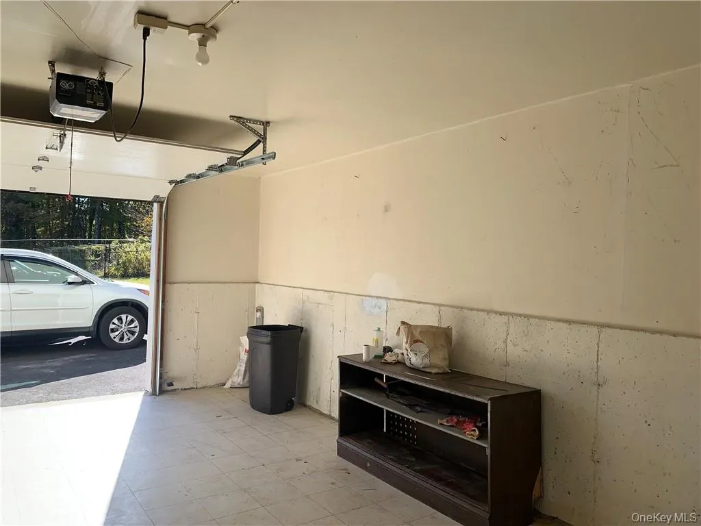 Garage featuring a garage door opener Garage featuring a garage door opener