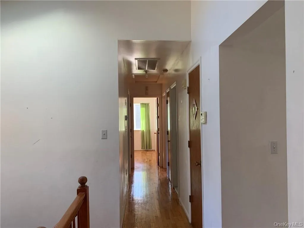 Hall with hardwood / wood-style flooring Hall with hardwood / wood-style flooring