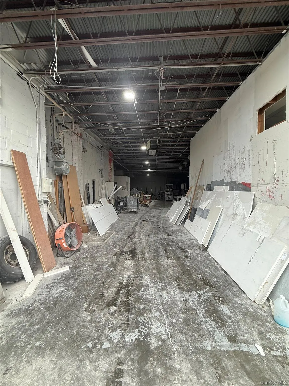 Miscellaneous room featuring concrete block wall Miscellaneous room featuring concrete block wall