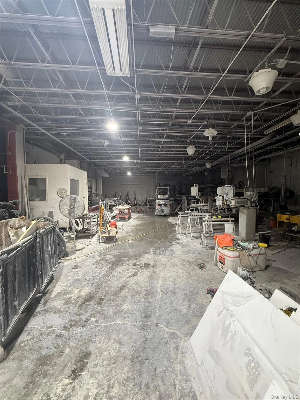 Miscellaneous room featuring a workshop area Miscellaneous room featuring a workshop area