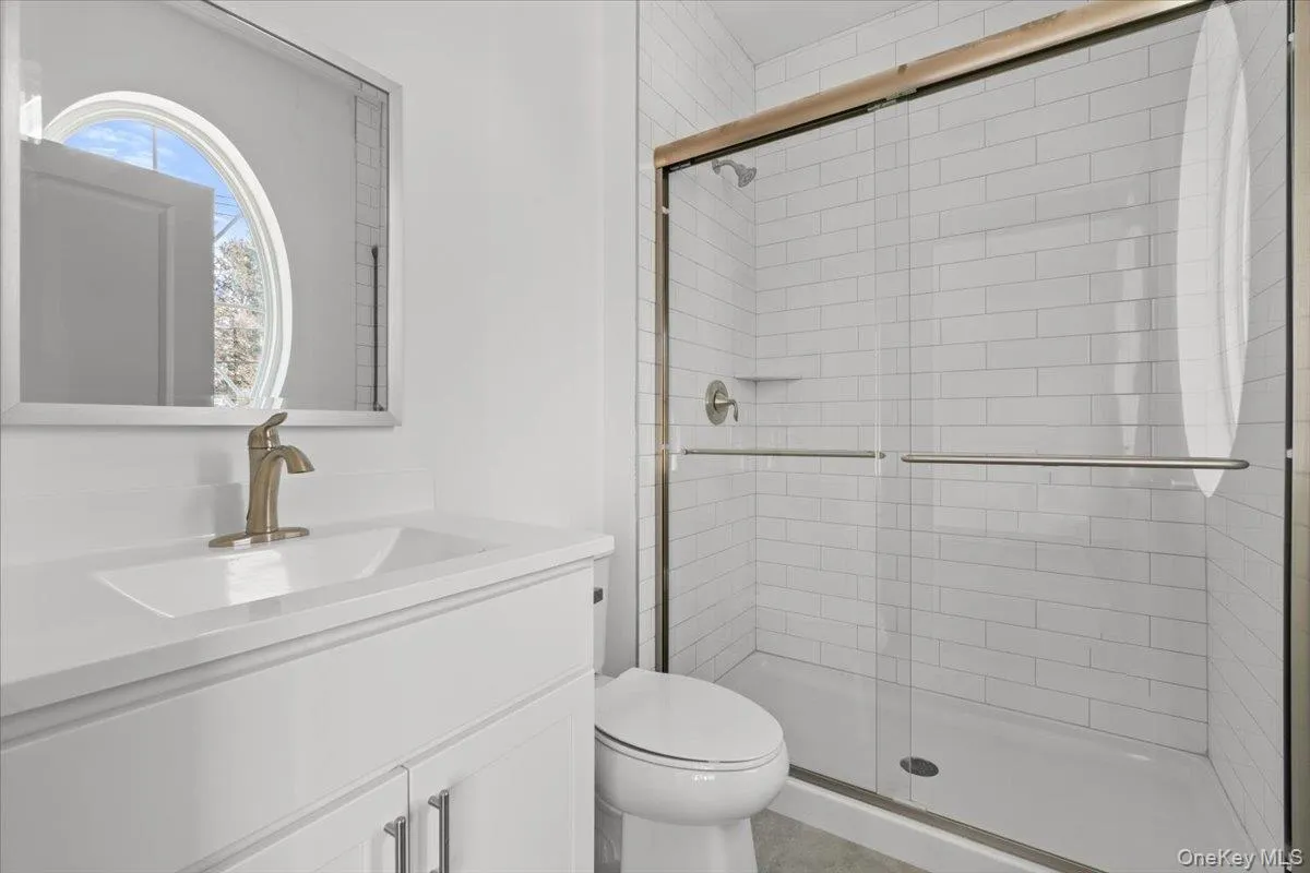 Full bath with vanity and a stall shower Full bath with vanity and a stall shower