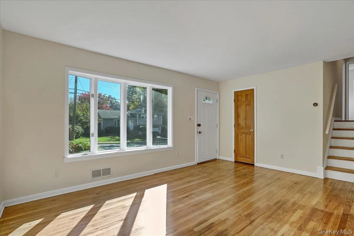 Living room featuring light hardwood / wood-style floors Living room featuring light hardwood / wood-style floors