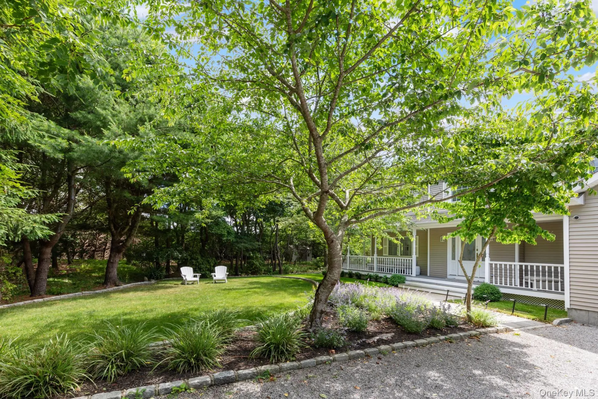 View of grassy yard featuring a porch View of grassy yard featuring a porch