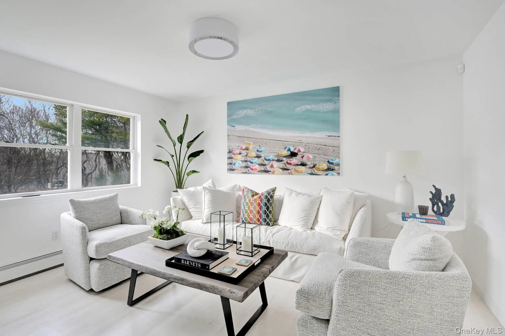 Living room with wood finished floors and baseboards Living room with wood finished floors and baseboards