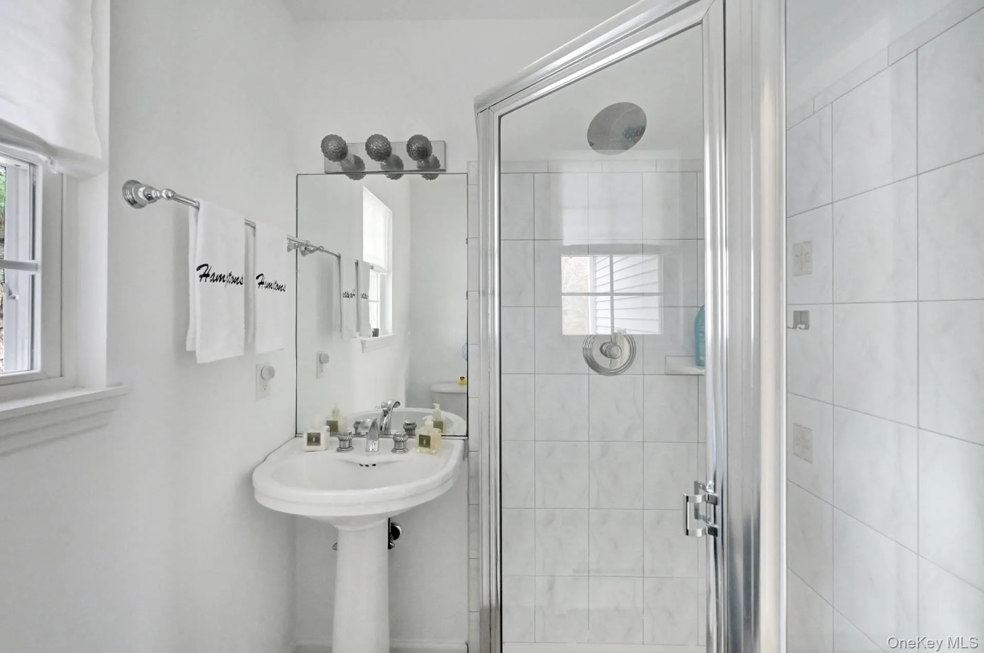 Bathroom featuring a stall shower Bathroom featuring a stall shower