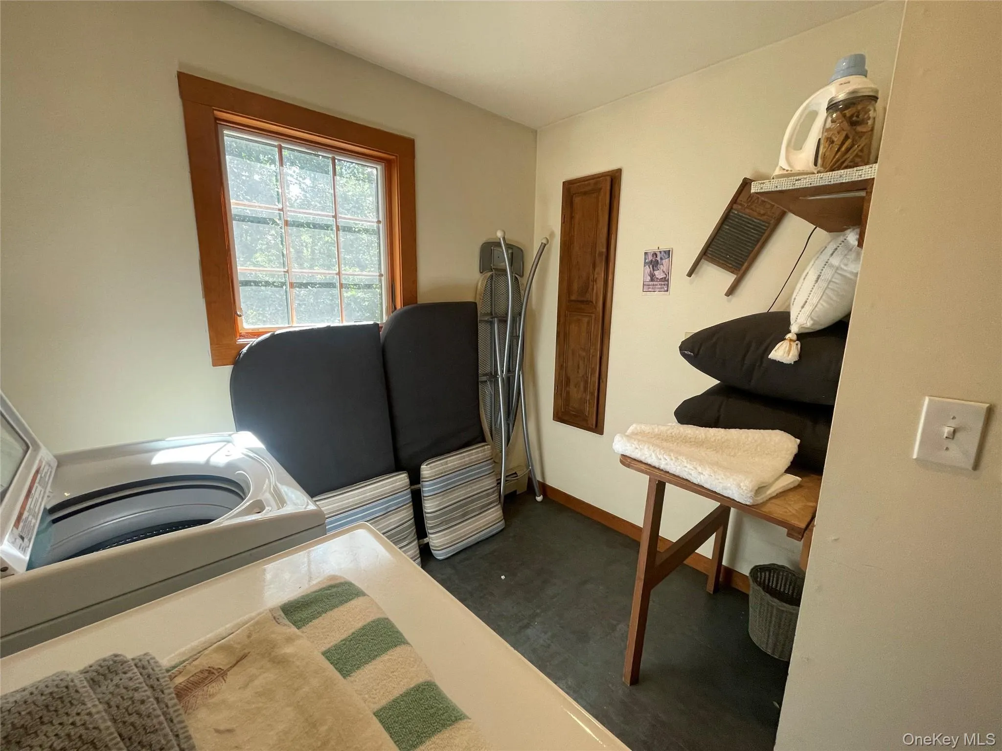 Laundry area with baseboards Laundry area with baseboards