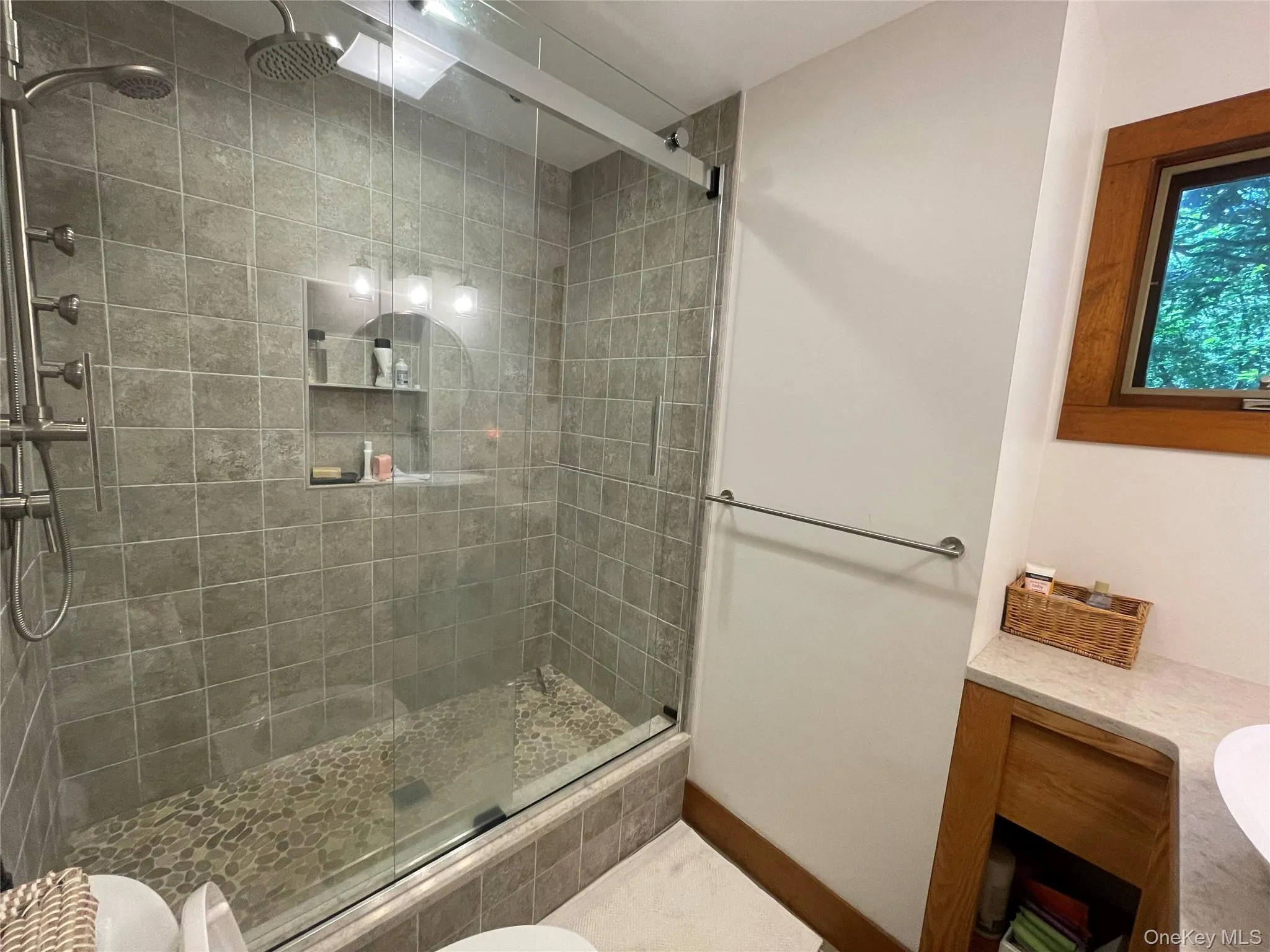 Bathroom featuring vanity and a shower stall Bathroom featuring vanity and a shower stall