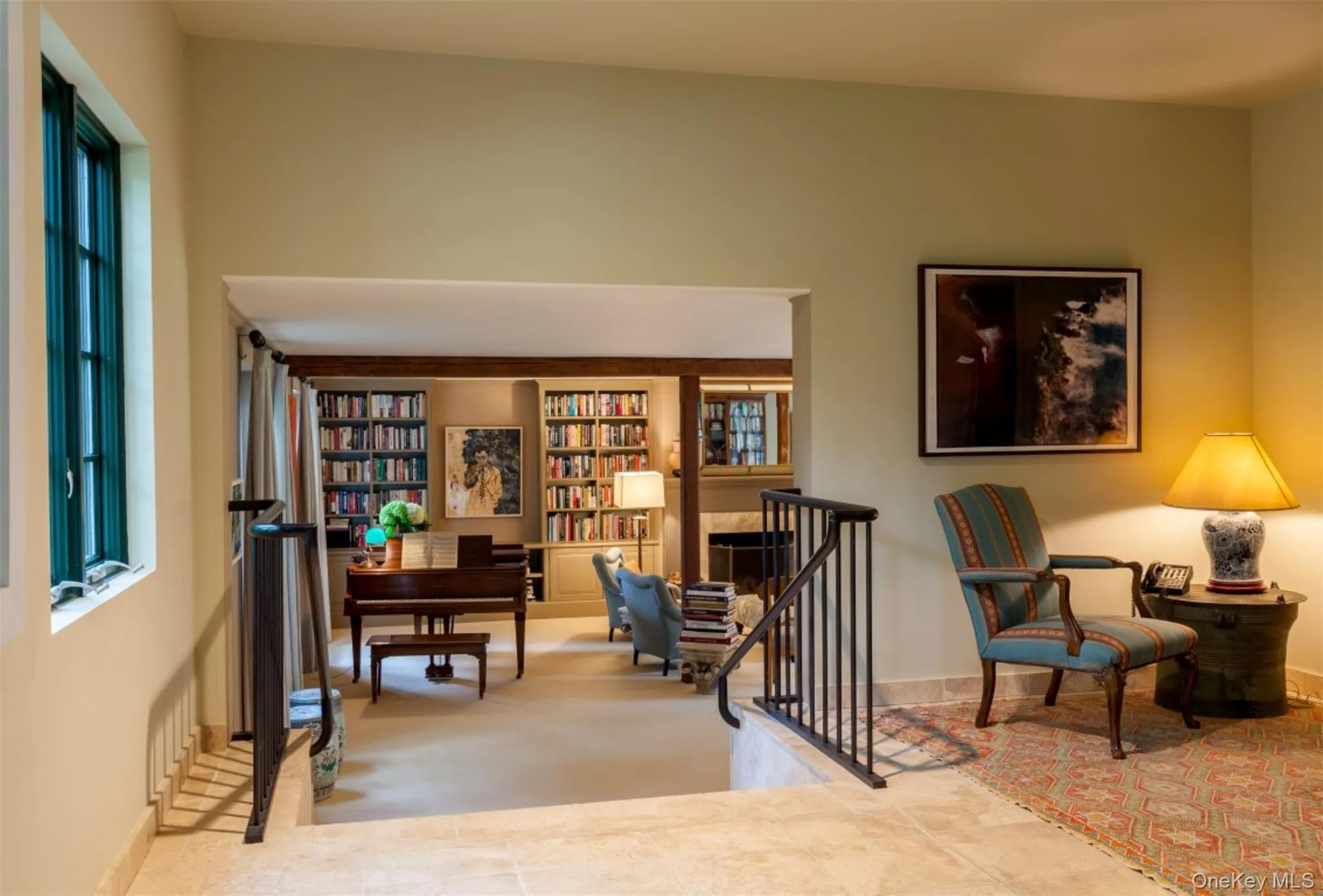 Sitting room with bookshelves and light colored carpet Sitting room with bookshelves and light colored carpet