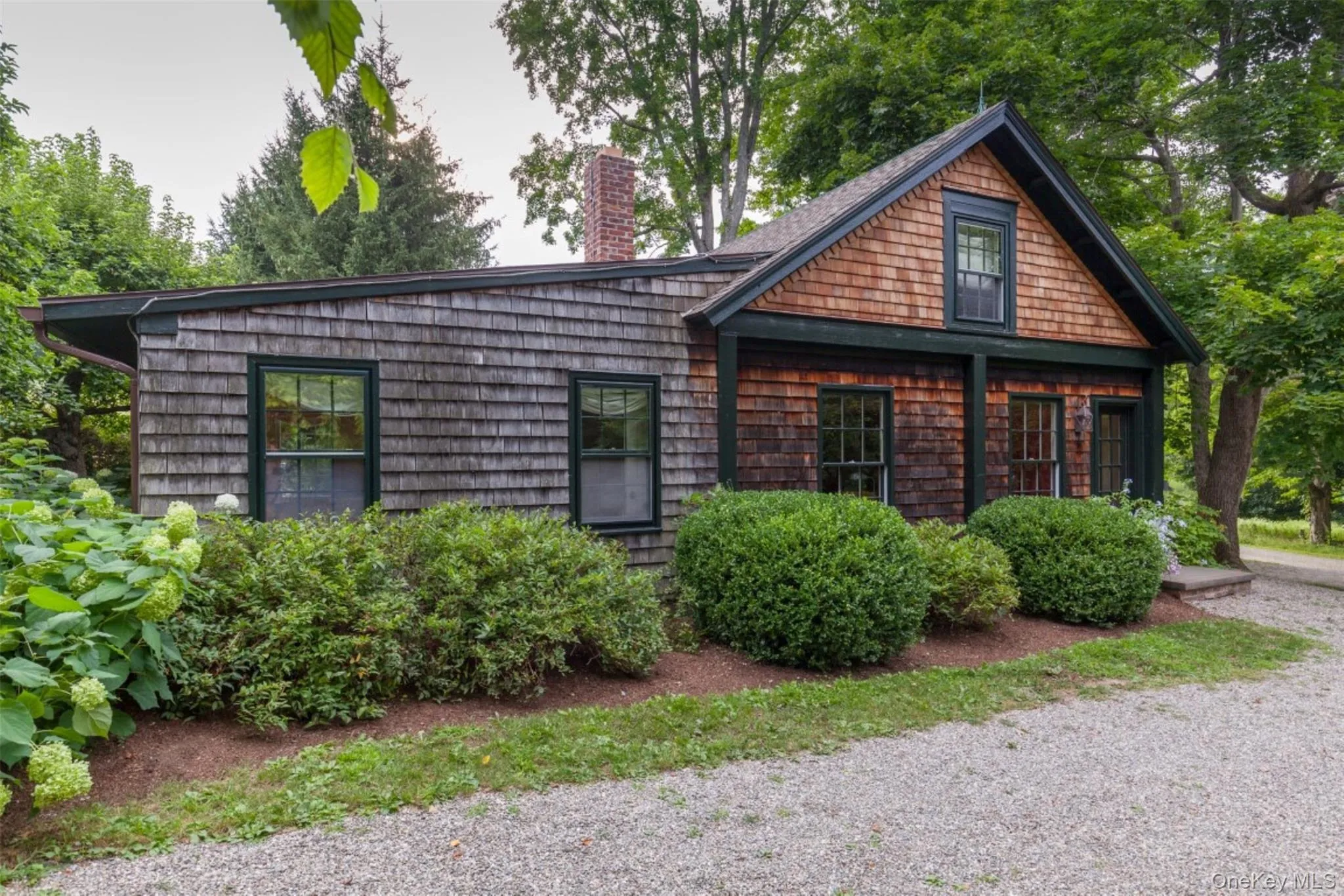 View of front of property featuring a chimney View of front of property featuring a chimney