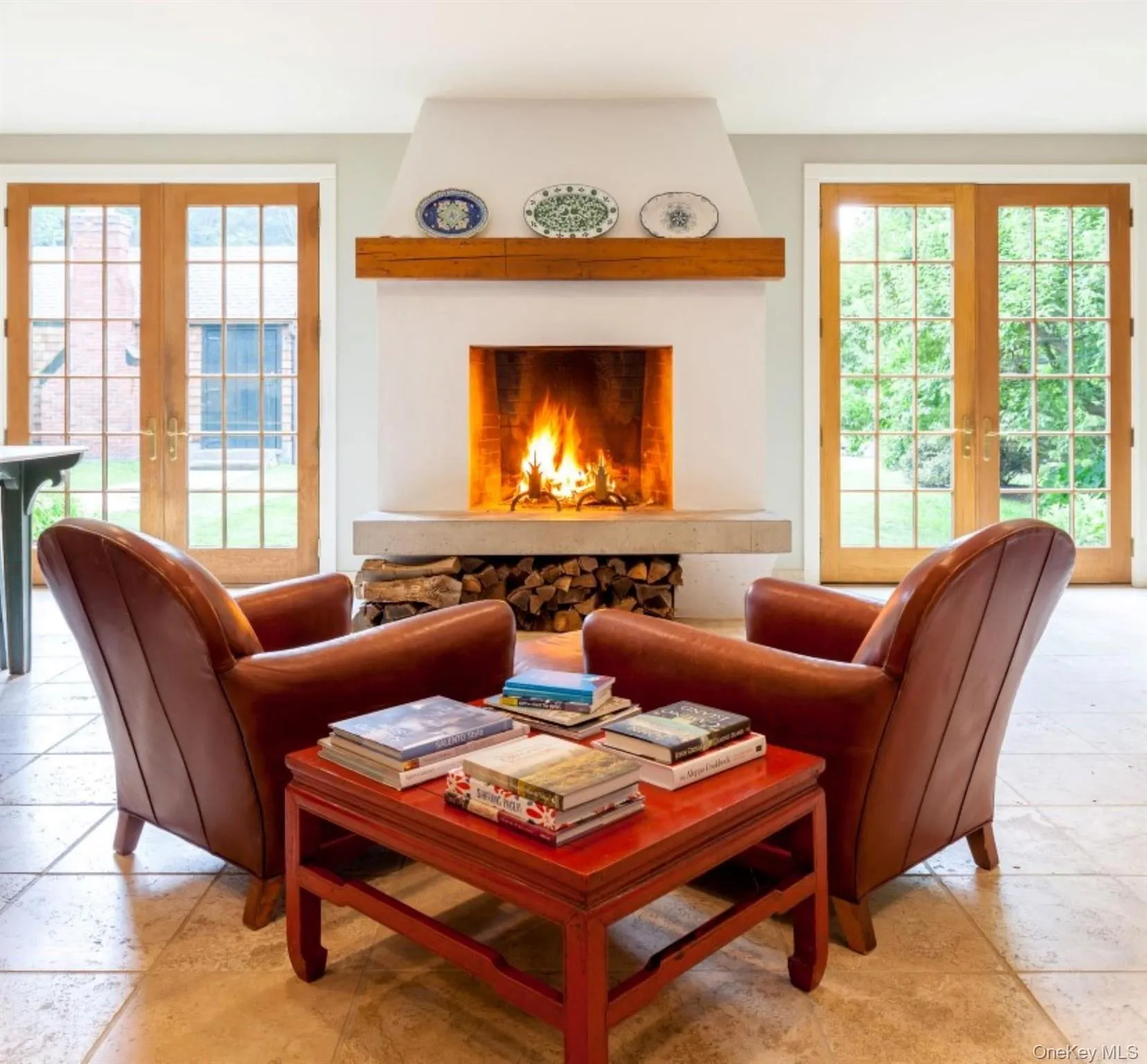 Living area with french doors and light tile patterned floors Living area with french doors and light tile patterned floors