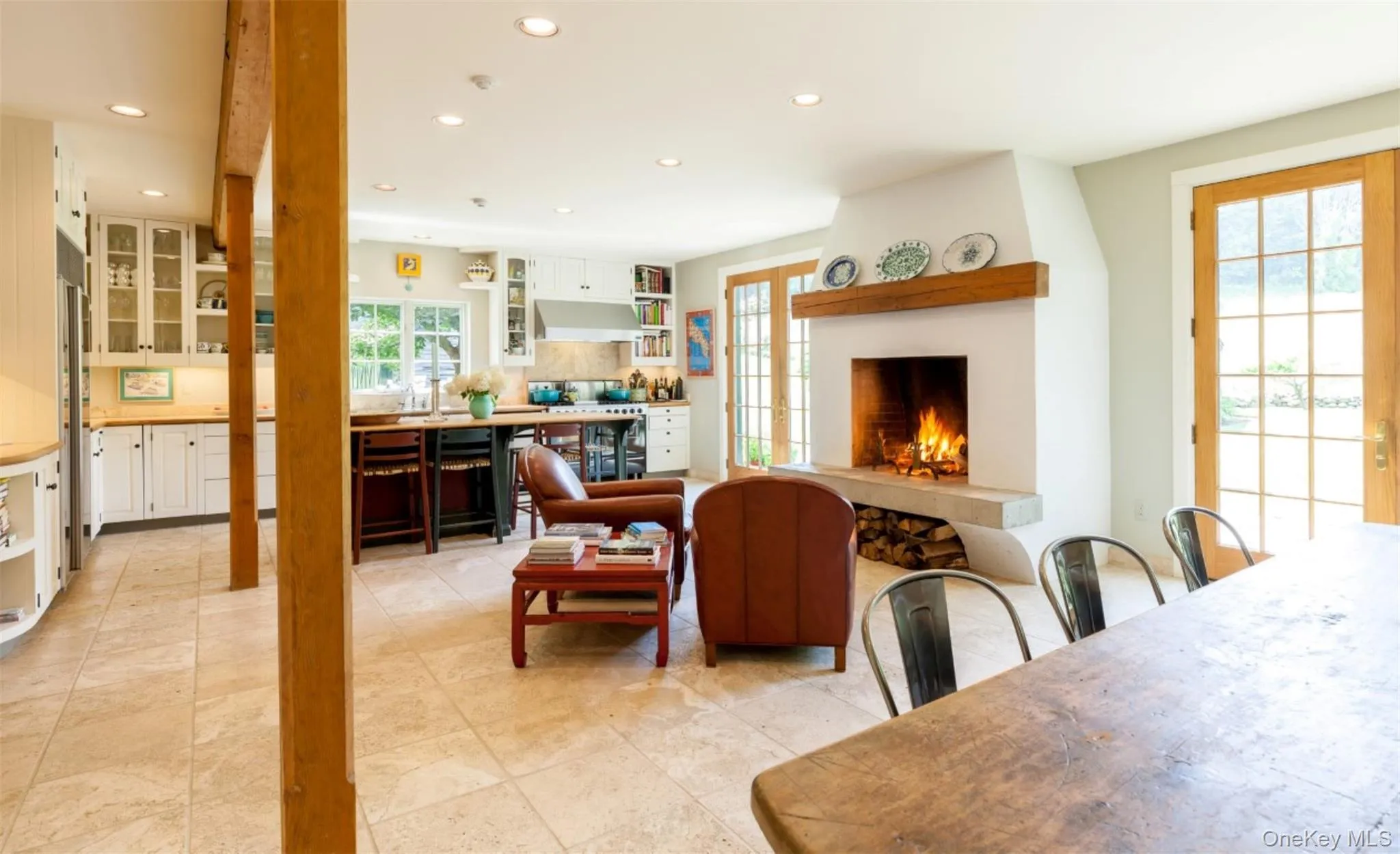 Dining area featuring recessed lighting and a large fireplace Dining area featuring recessed lighting and a large fireplace