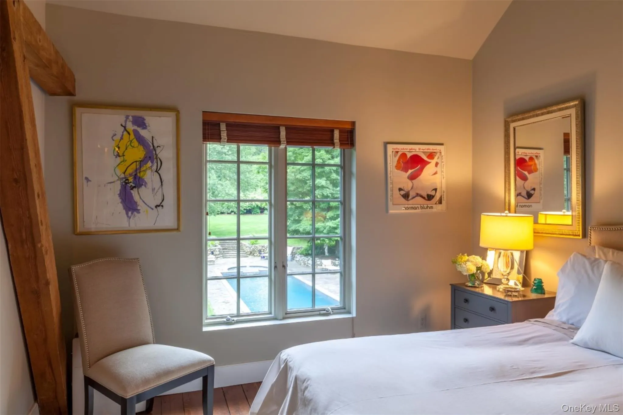 Bedroom with wood finished floors and baseboards Bedroom with wood finished floors and baseboards