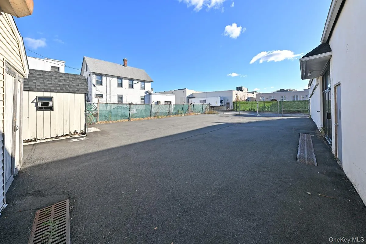 View of asphalt road featuring a residential view View of asphalt road featuring a residential view