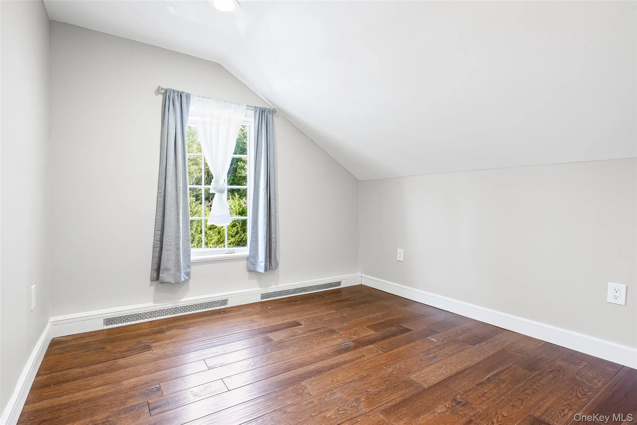 Bonus room featuring vaulted ceiling, hardwood / wood-style floors, and recessed lighting Bonus room featuring vaulted ceiling, hardwood / wood-style floors, and recessed lighting