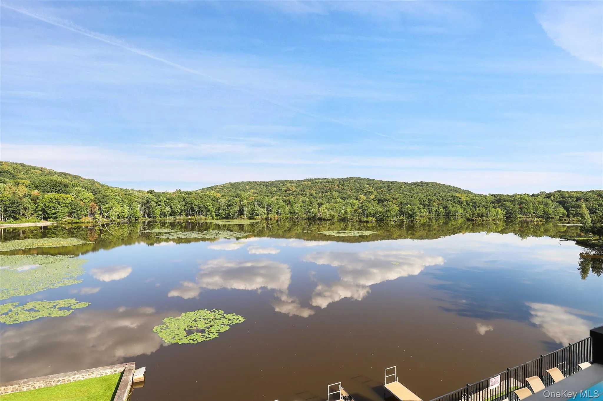Water view featuring a forest Water view featuring a forest