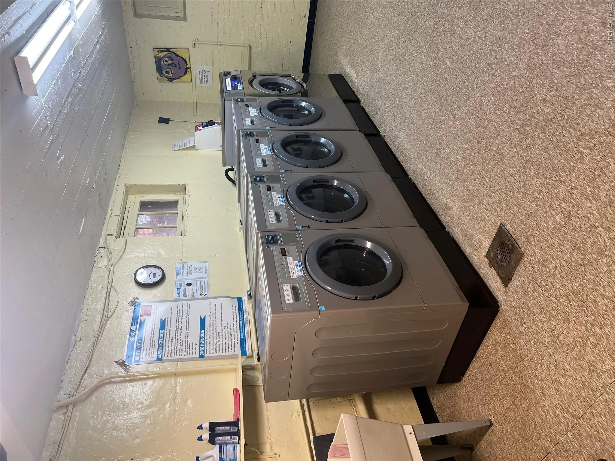 Shared laundry area featuring washer and clothes dryer Shared laundry area featuring washer and clothes dryer