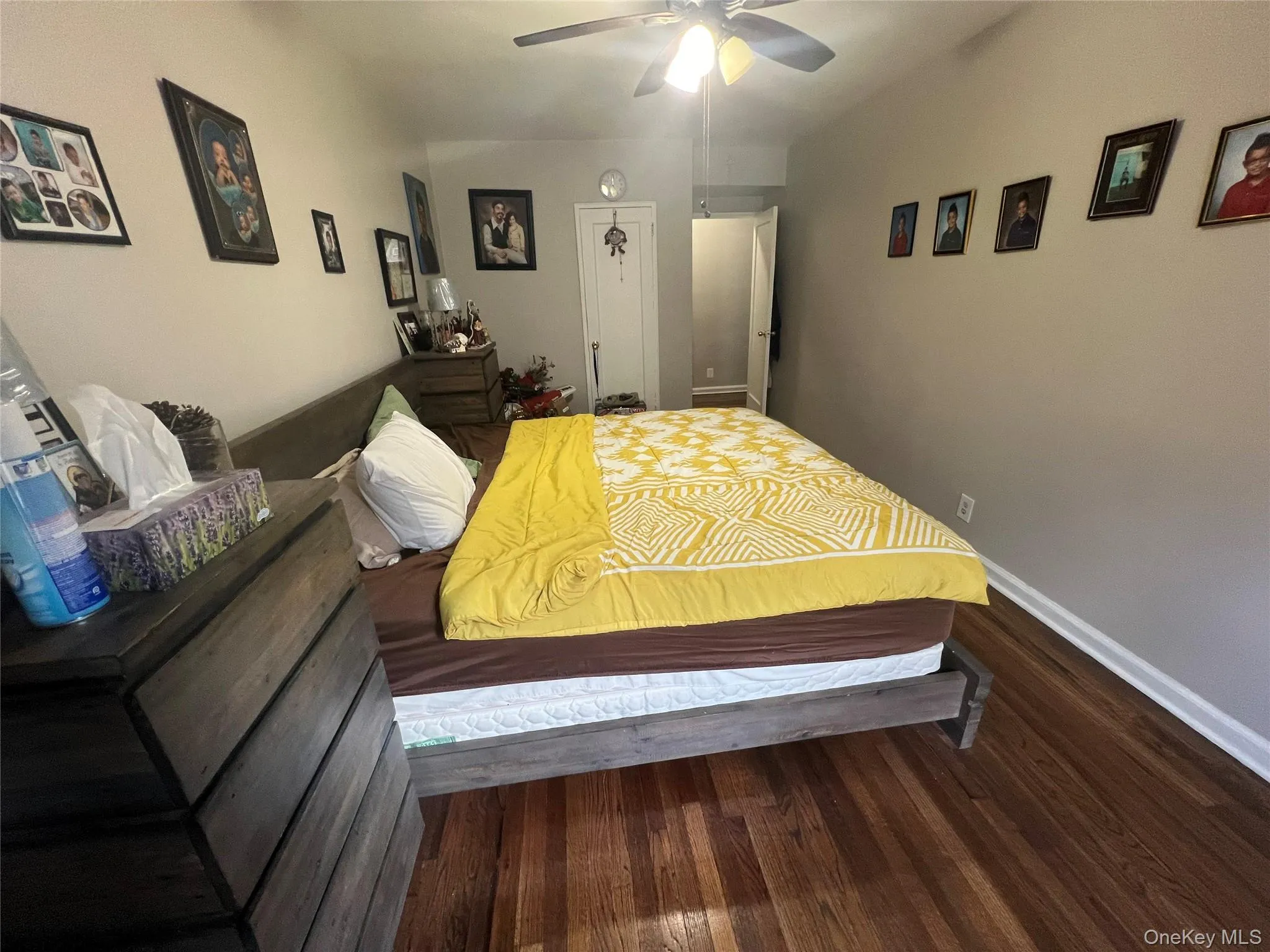 Bedroom with baseboards, a ceiling fan, and wood finished floors Bedroom with baseboards, a ceiling fan, and wood finished floors