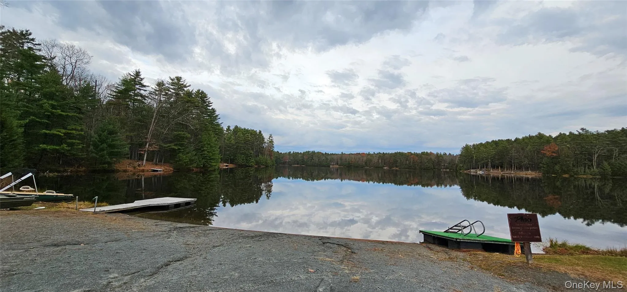 Water view with a boat ramp and a boat dock Water view with a boat ramp and a boat dock