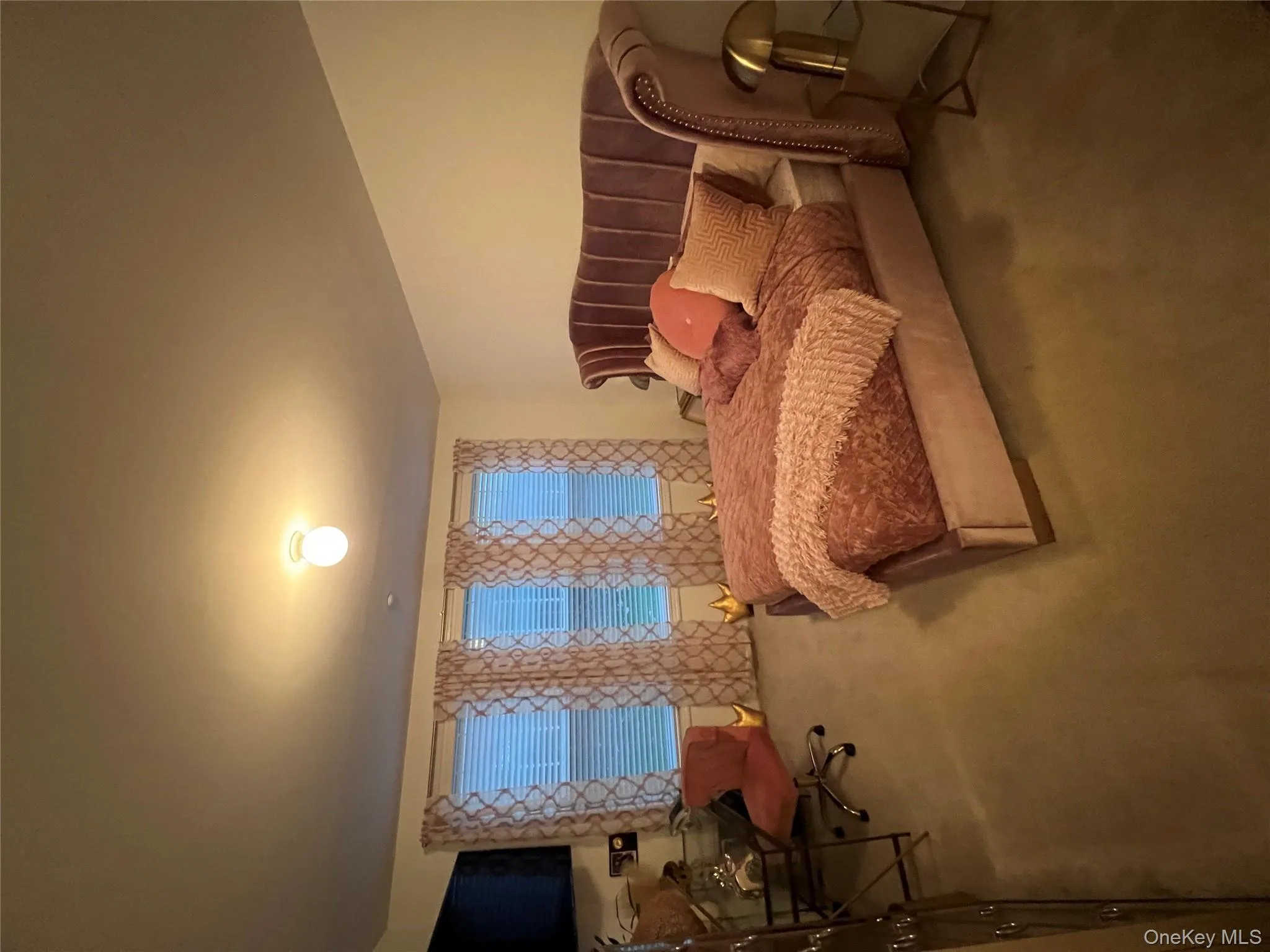 Carpeted bedroom with an office area Carpeted bedroom with an office area