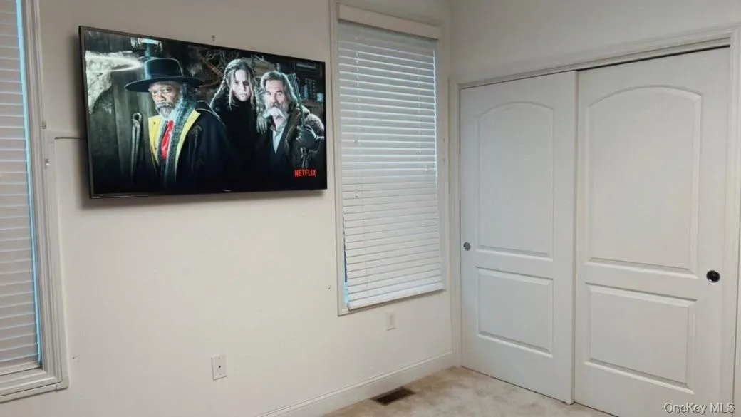 Unfurnished bedroom with a closet and baseboards Unfurnished bedroom with a closet and baseboards