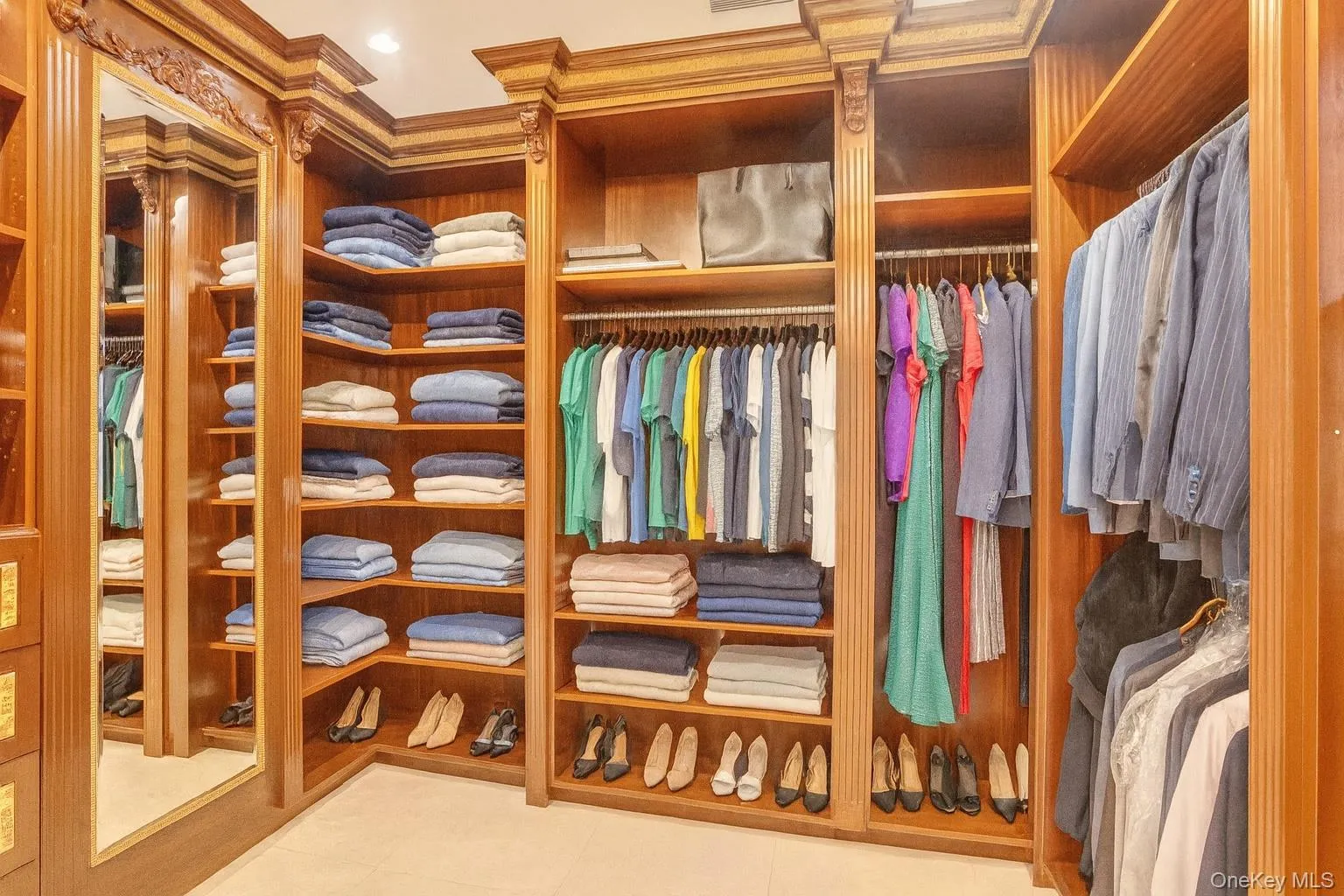 Walk in closet featuring light tile patterned floors Walk in closet featuring light tile patterned floors