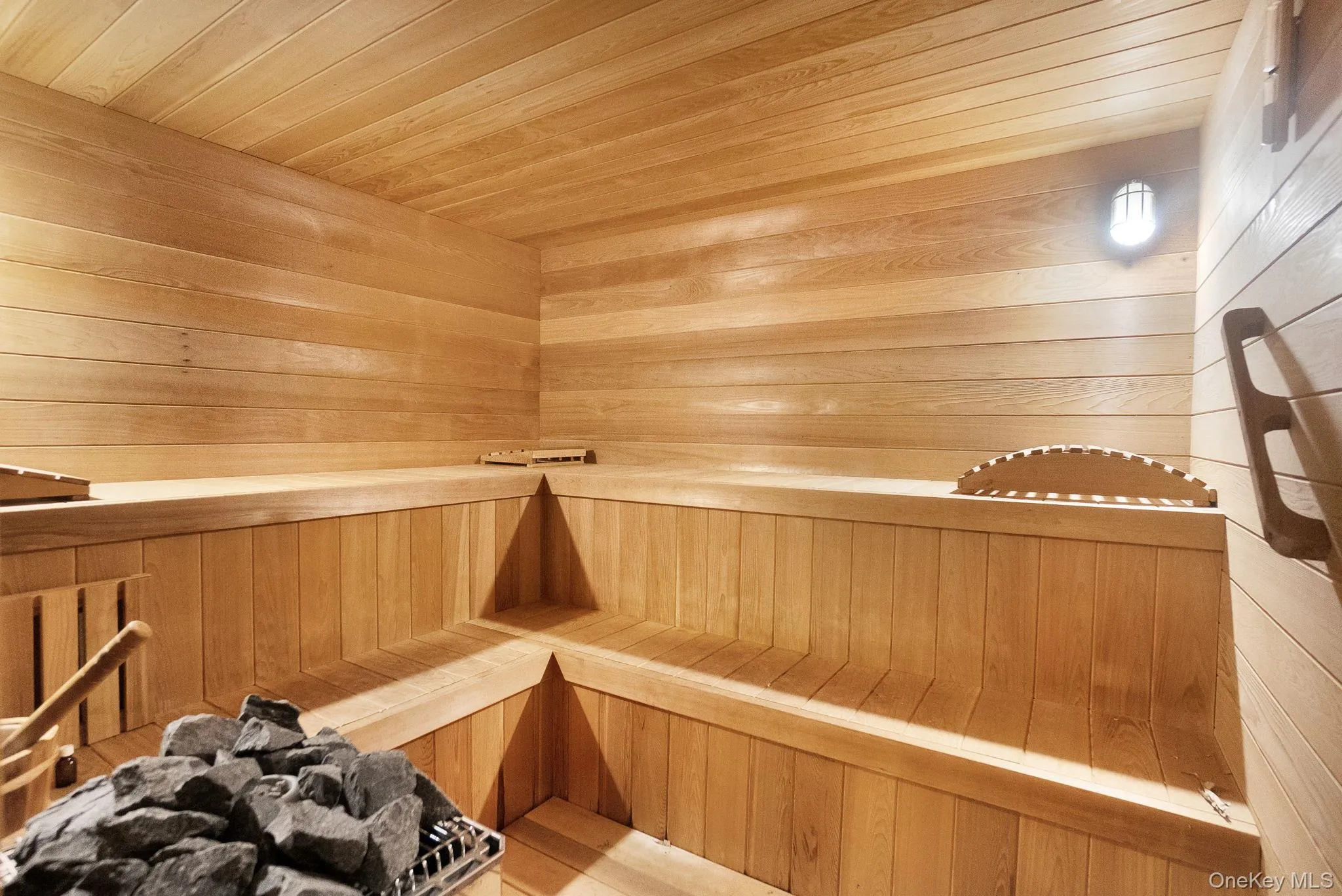 Sauna / steam room with wooden ceiling and wood walls Sauna / steam room with wooden ceiling and wood walls