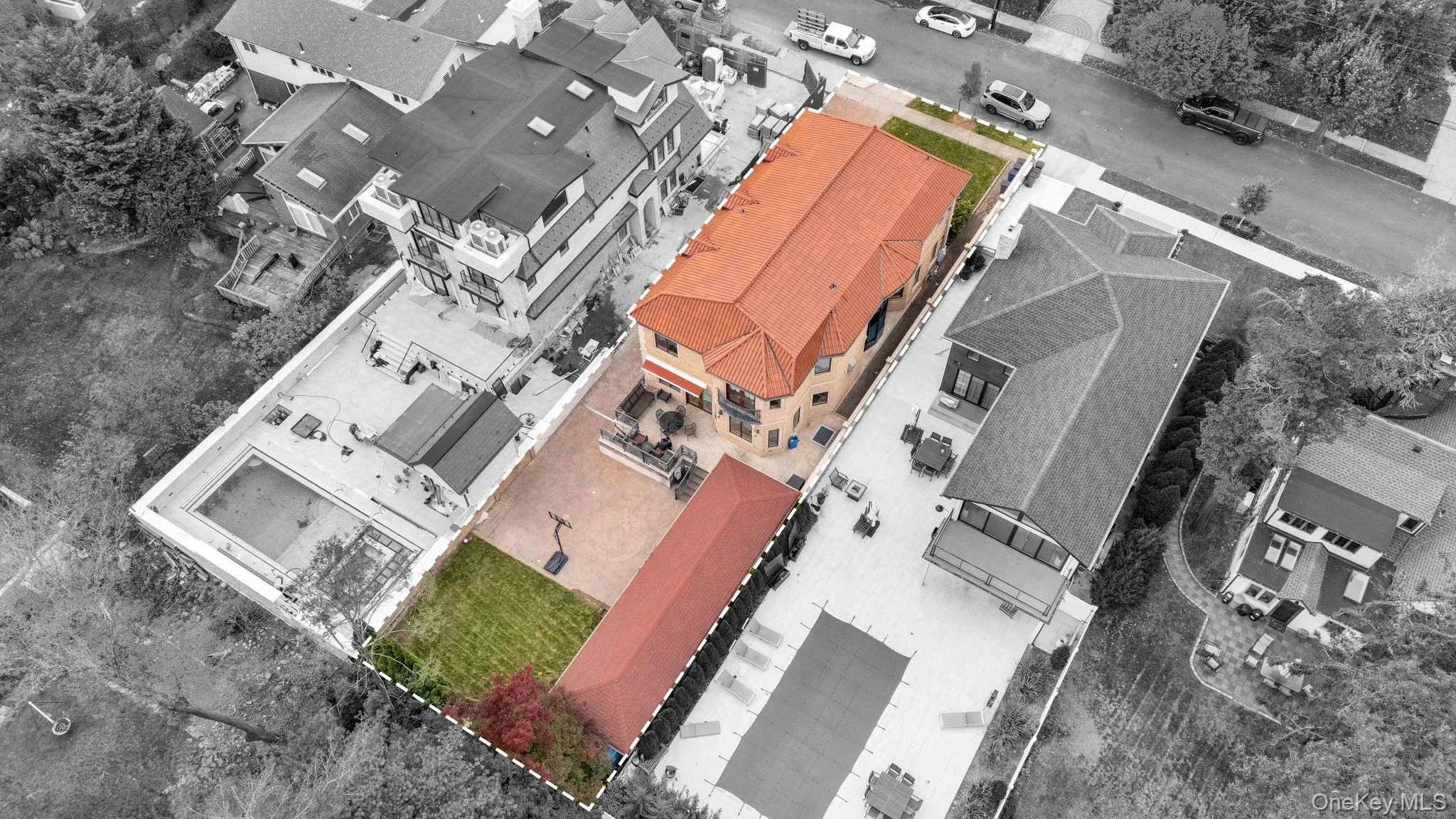 Aerial view of property and surrounding area featuring property boundaries highlighted Aerial view of property and surrounding area featuring property boundaries highlighted