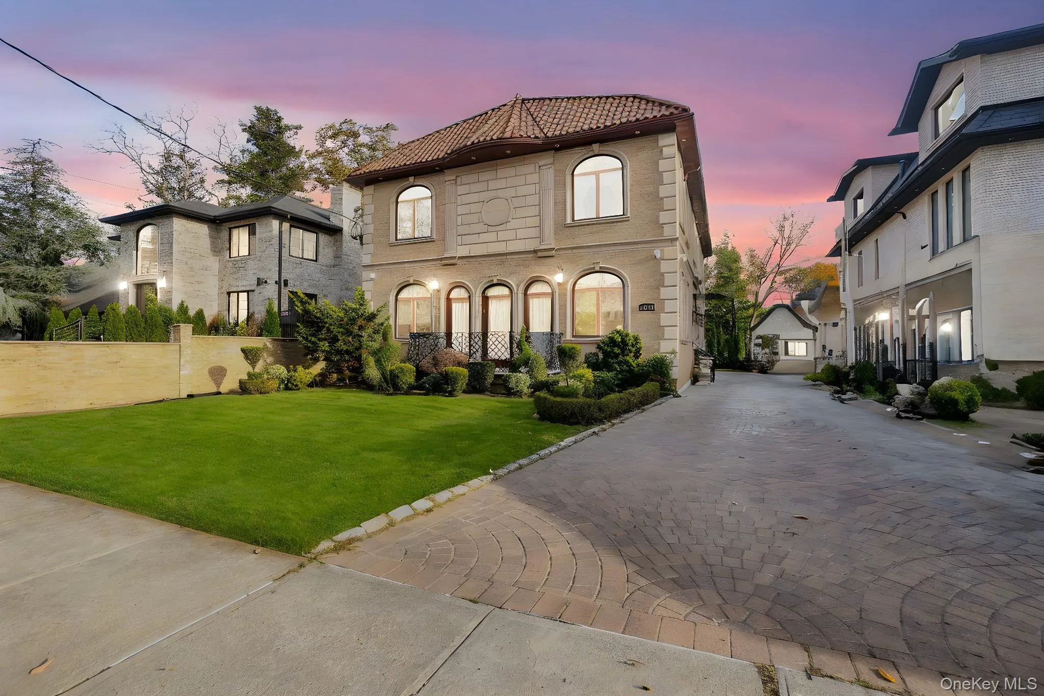 Mediterranean / spanish-style home featuring a tile roof and driveway Mediterranean / spanish-style home featuring a tile roof and driveway
