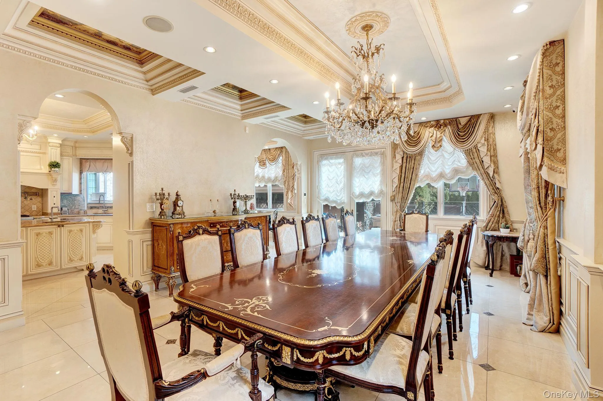 Dining space featuring arched walkways, french doors, ornamental molding, light tile patterned floors, and recessed lighting Dining space featuring arched walkways, french doors, ornamental molding, light tile patterned floors, and recessed lighting