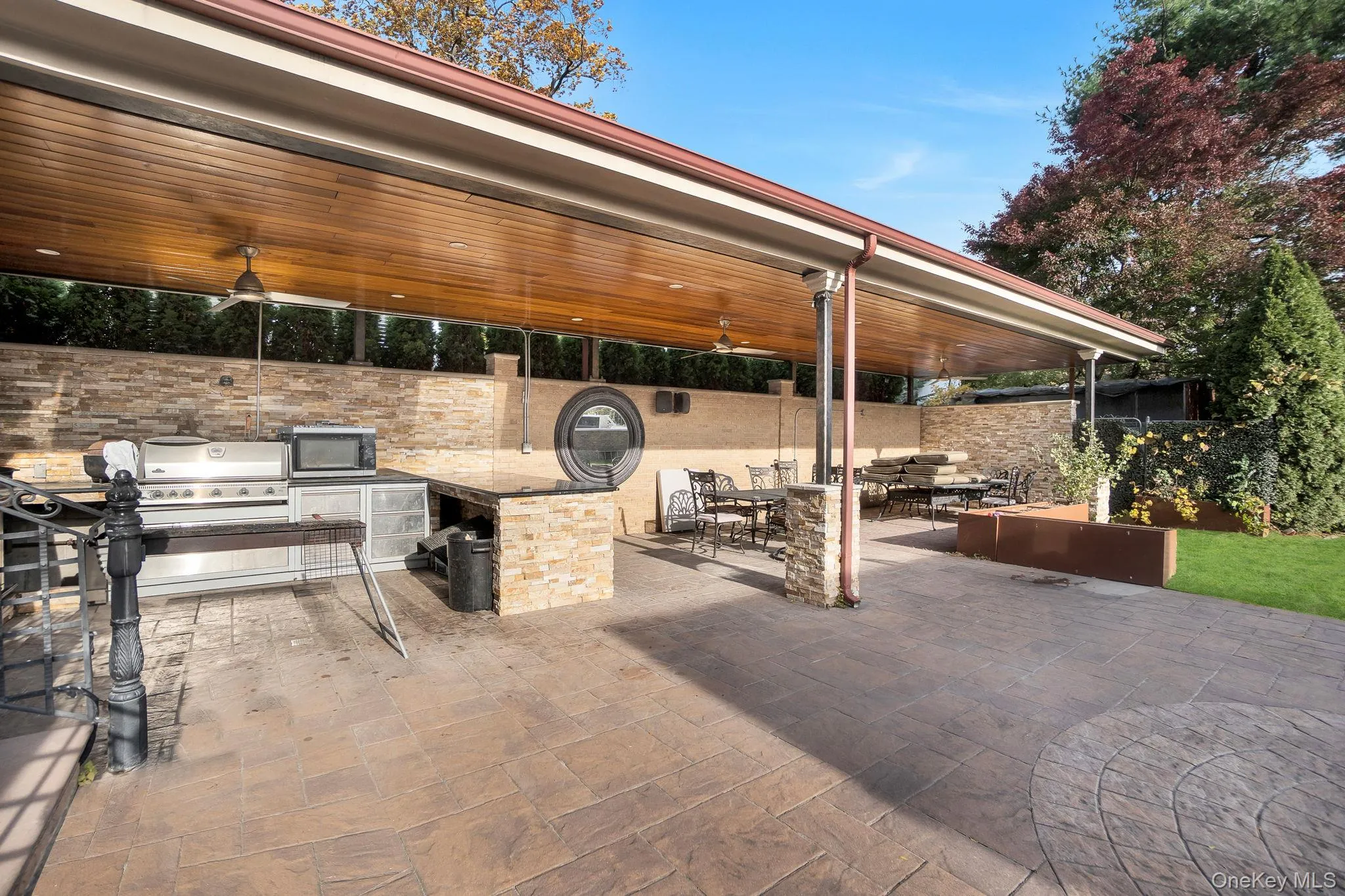 View of patio / terrace featuring exterior kitchen and outdoor dining space View of patio / terrace featuring exterior kitchen and outdoor dining space